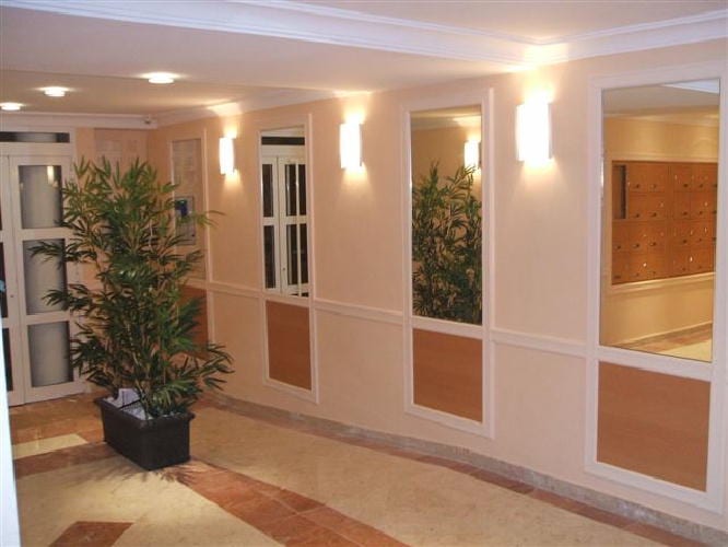 architectural photography of black and brown hallway